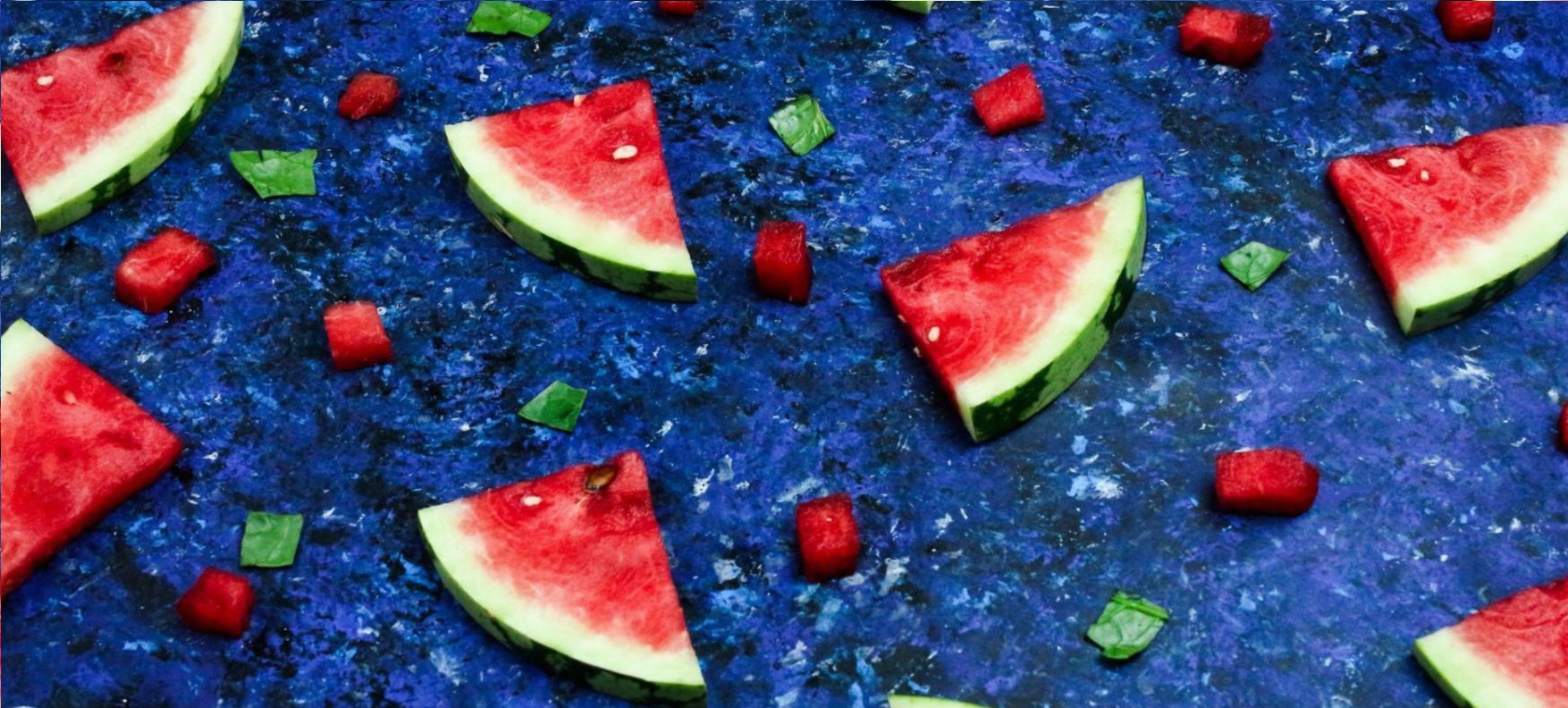Fresh vegetables and legumes arranged on a kitchen surface